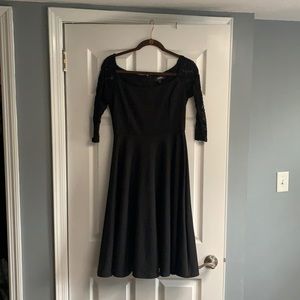Lulu’s little black dress with lace 3/4 sleeves. Flare bottom. Very cute